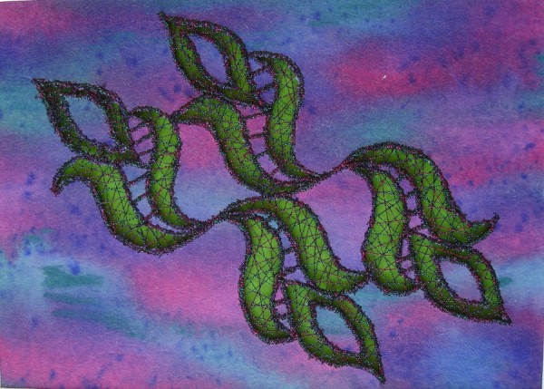 Machine embroidered cut-away design on dyed pelmet-vilene.