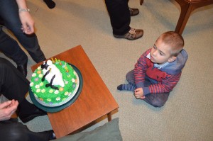 Waiting patiently for cake while adults keep talking